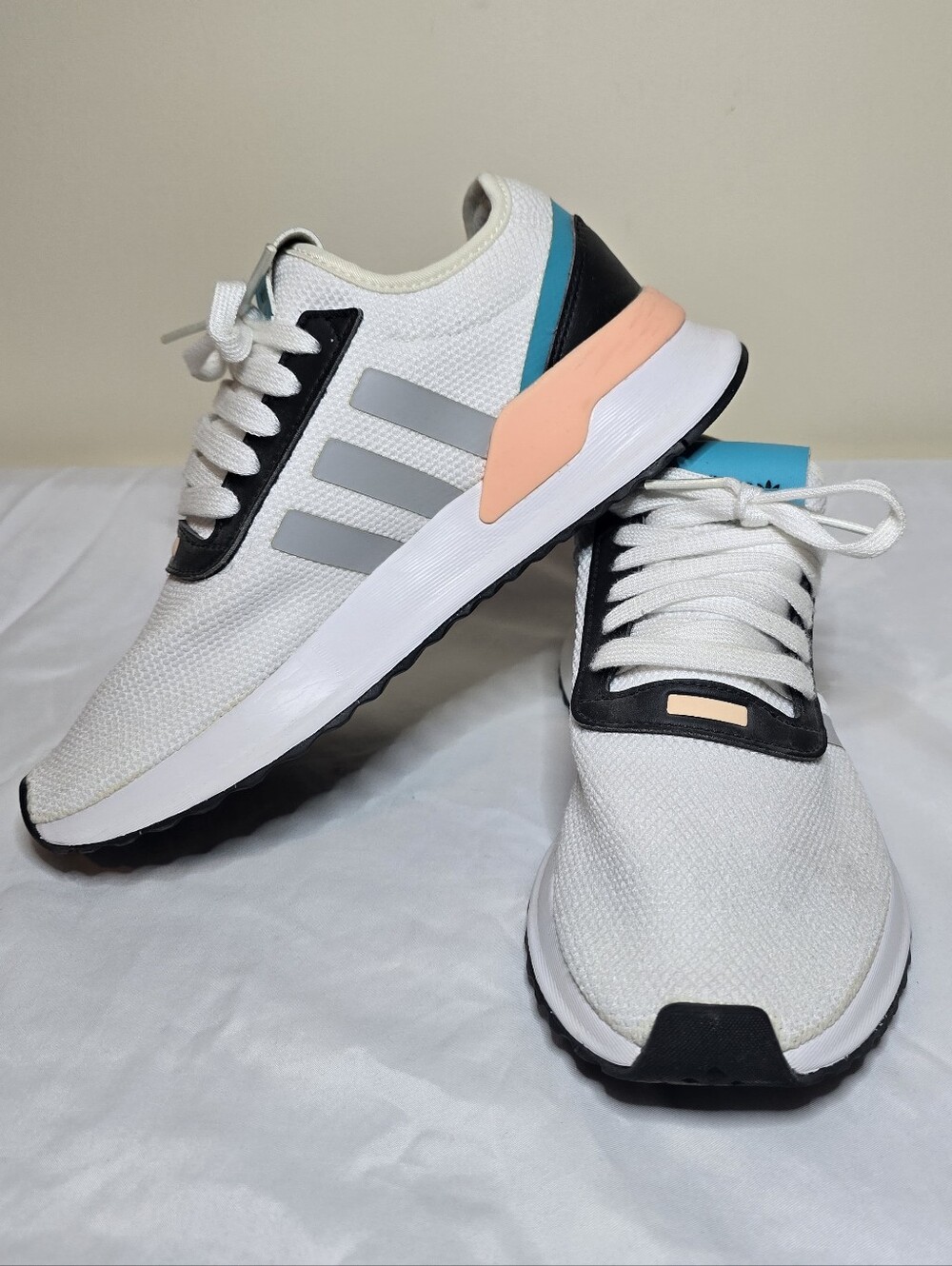 Adidas Women's U_Path Run sneakers in white with black and coral accents.